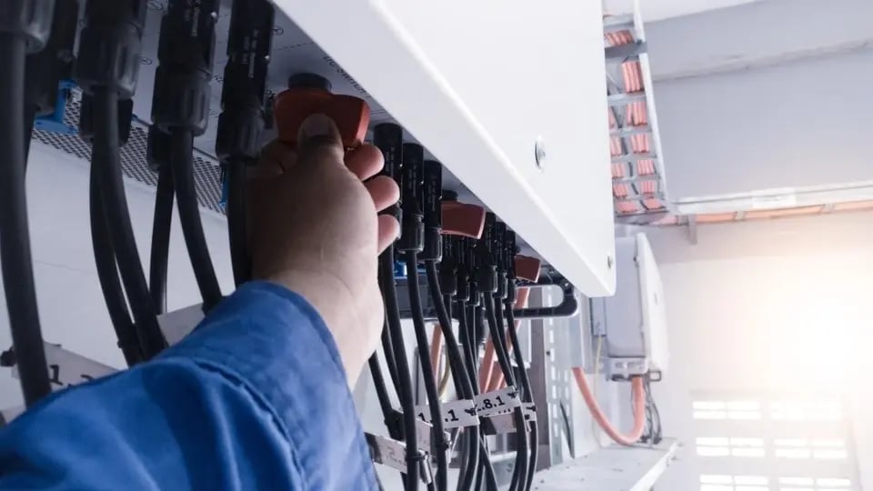 Technician-checking-connectors
